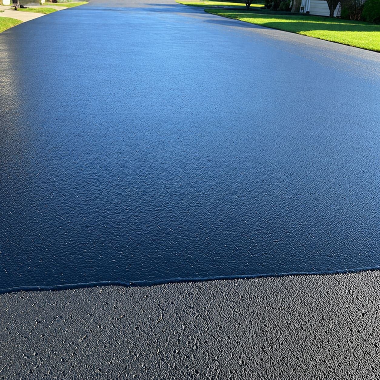 Close-up of cracked asphalt pavement surface before repair